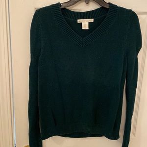 Dark green, long sleeve sweater with 3 cut outs down both arms.